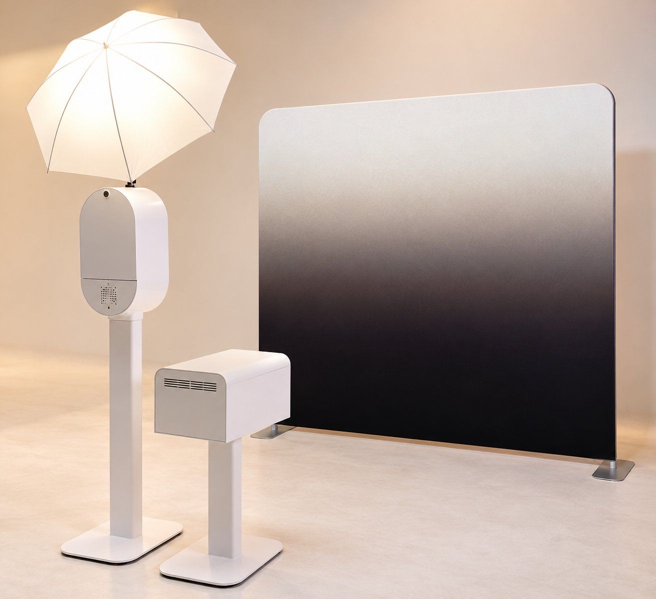 White DSLR photo booth with umbrella light, print station and gradient backdrop